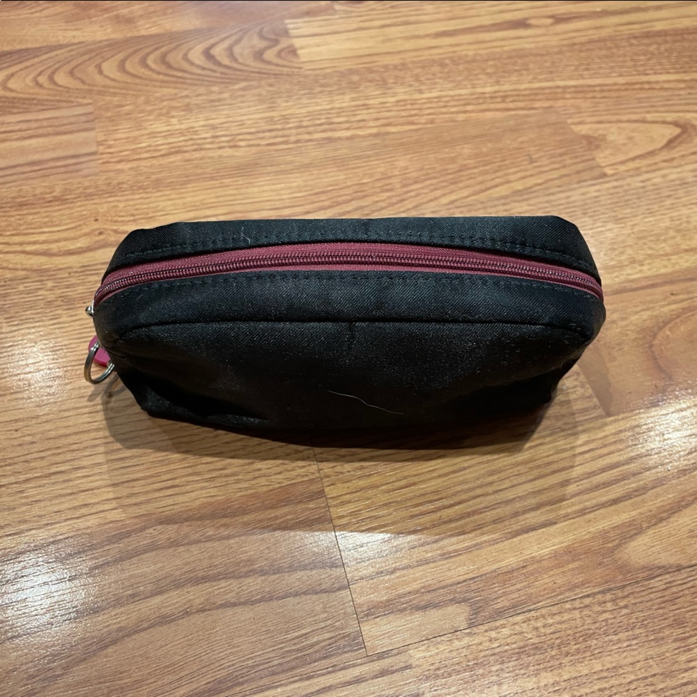 Ipsy black and maroon makeup bag